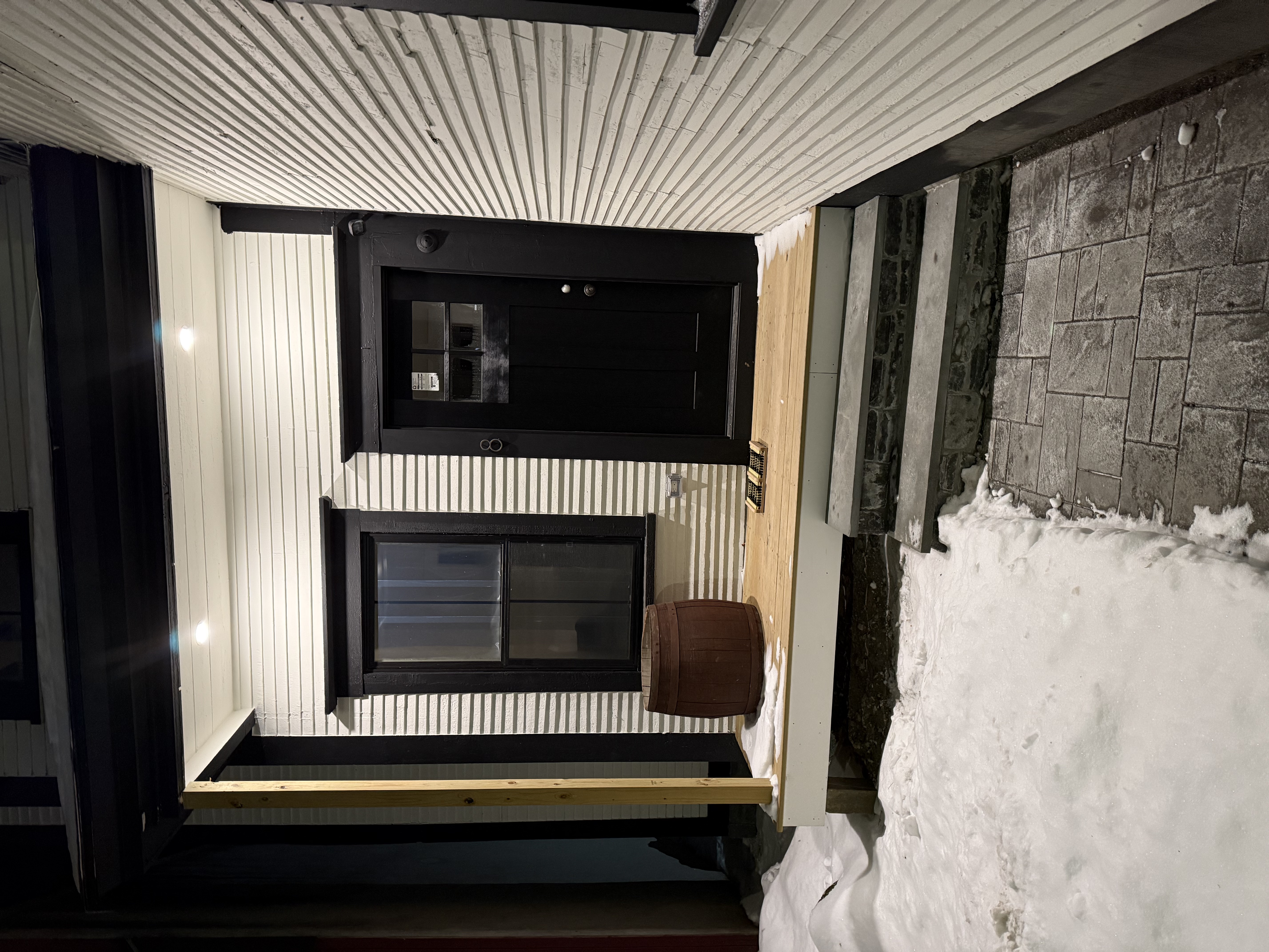 Front door of the house, lit at night